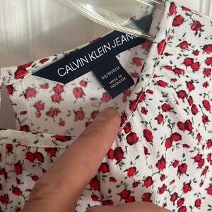 Calvin Klein red and white patterned blouse